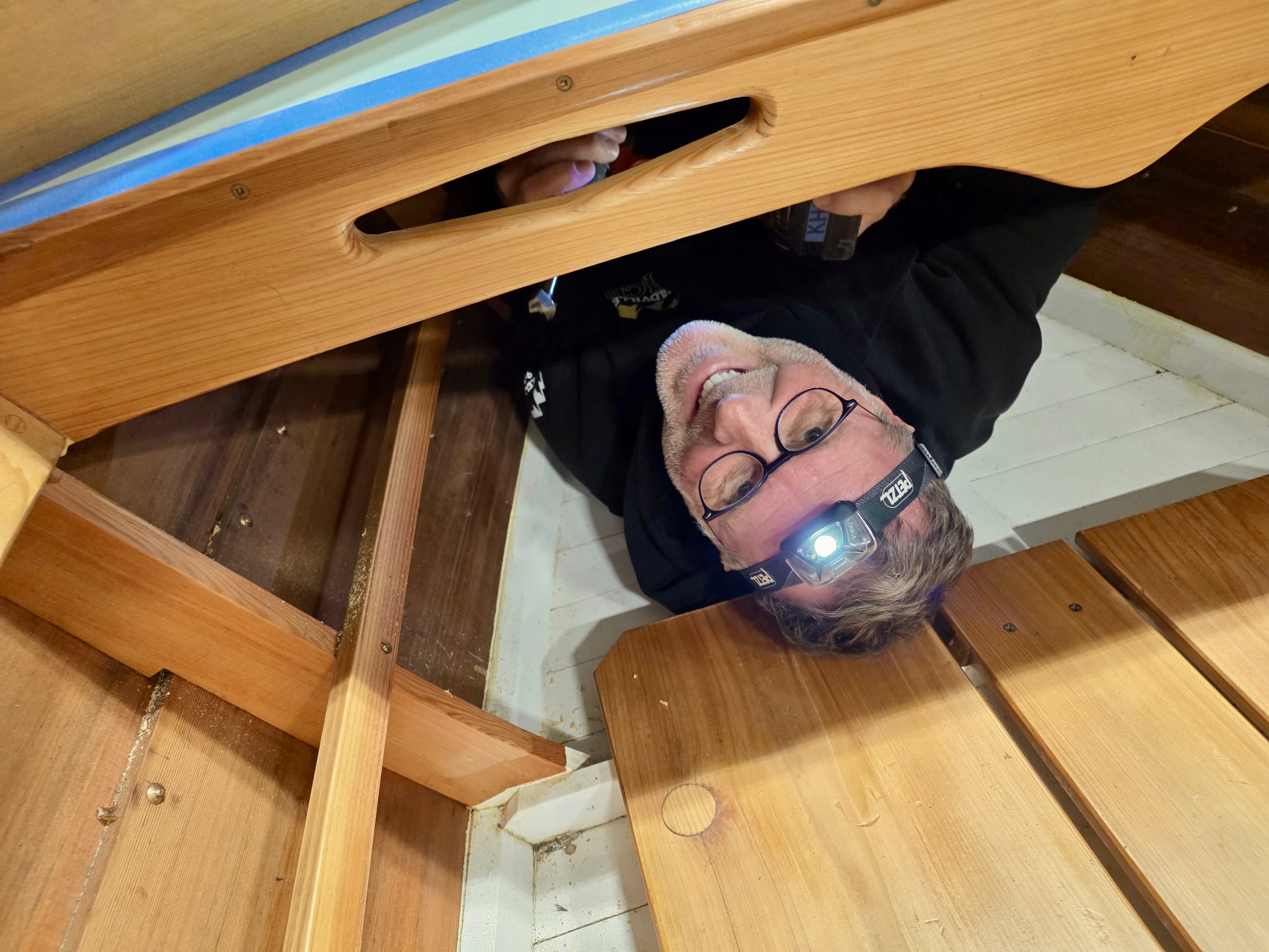 Kelley Hale working inside the runabout hull